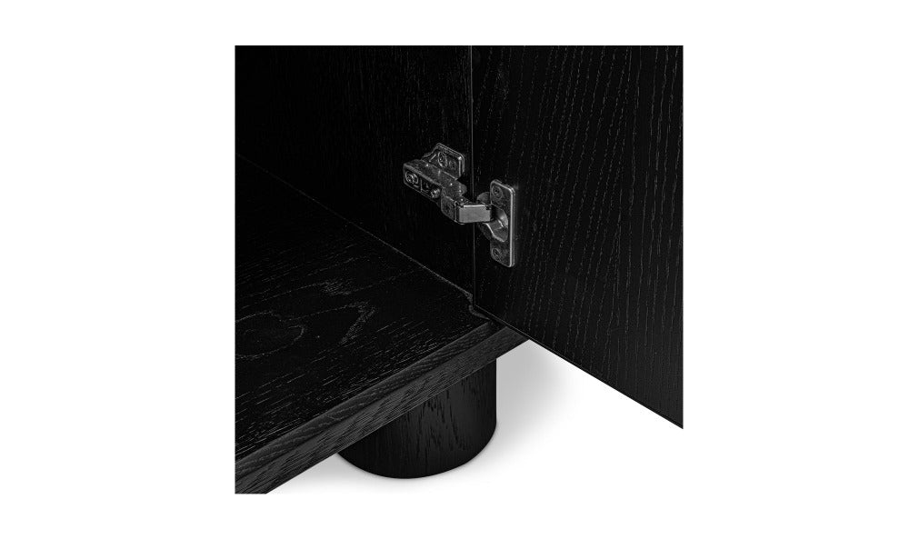 Close-up of a black wooden sideboard with a visible hinge.