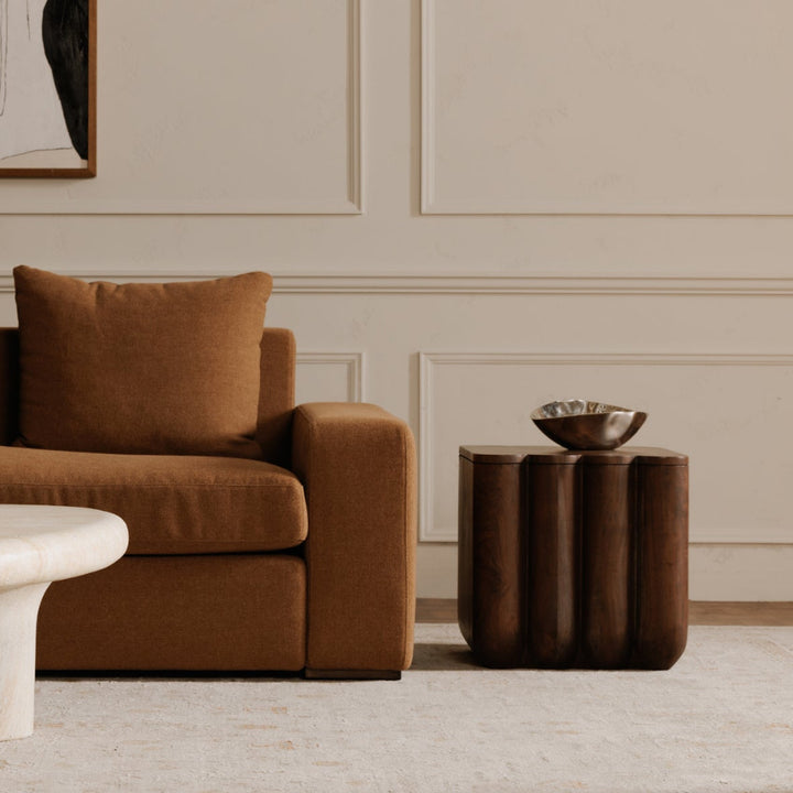 Living room with brown couch and accent table