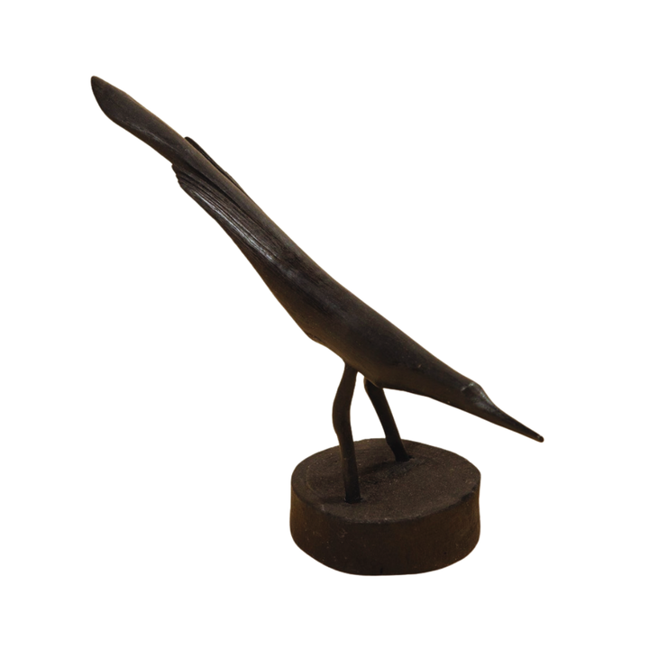 Bronze sculpture of a feather on a white background