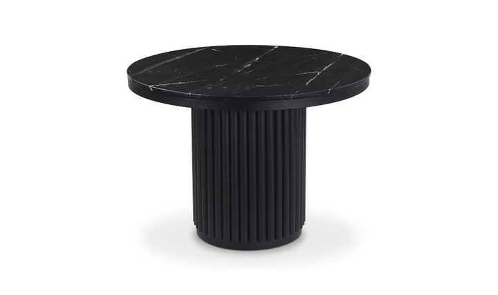 Black round table with marble-like top on a white background