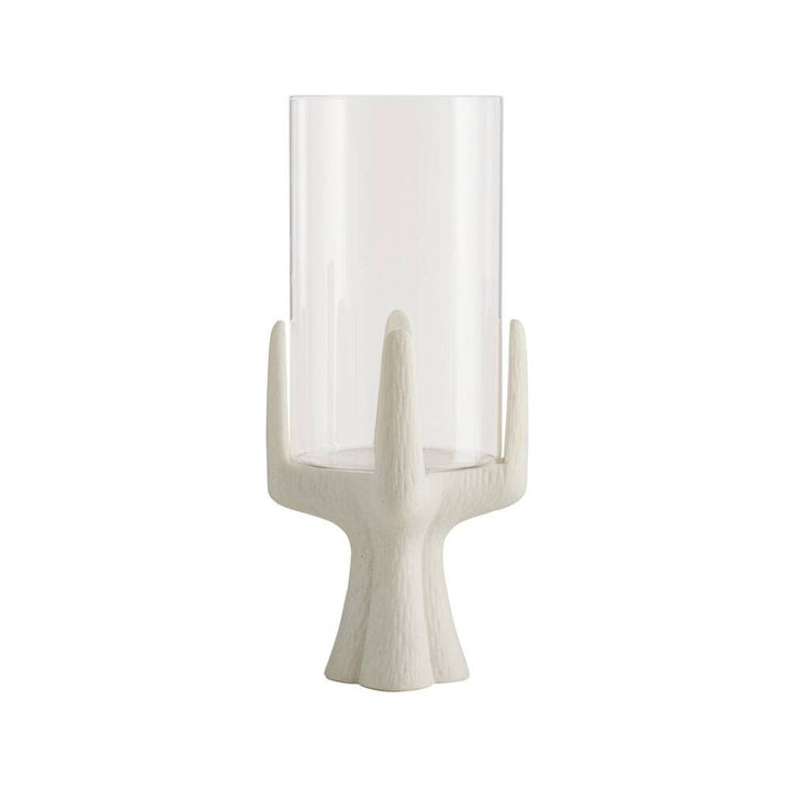 Decorative candle holder with a white base and clear glass container on a white background