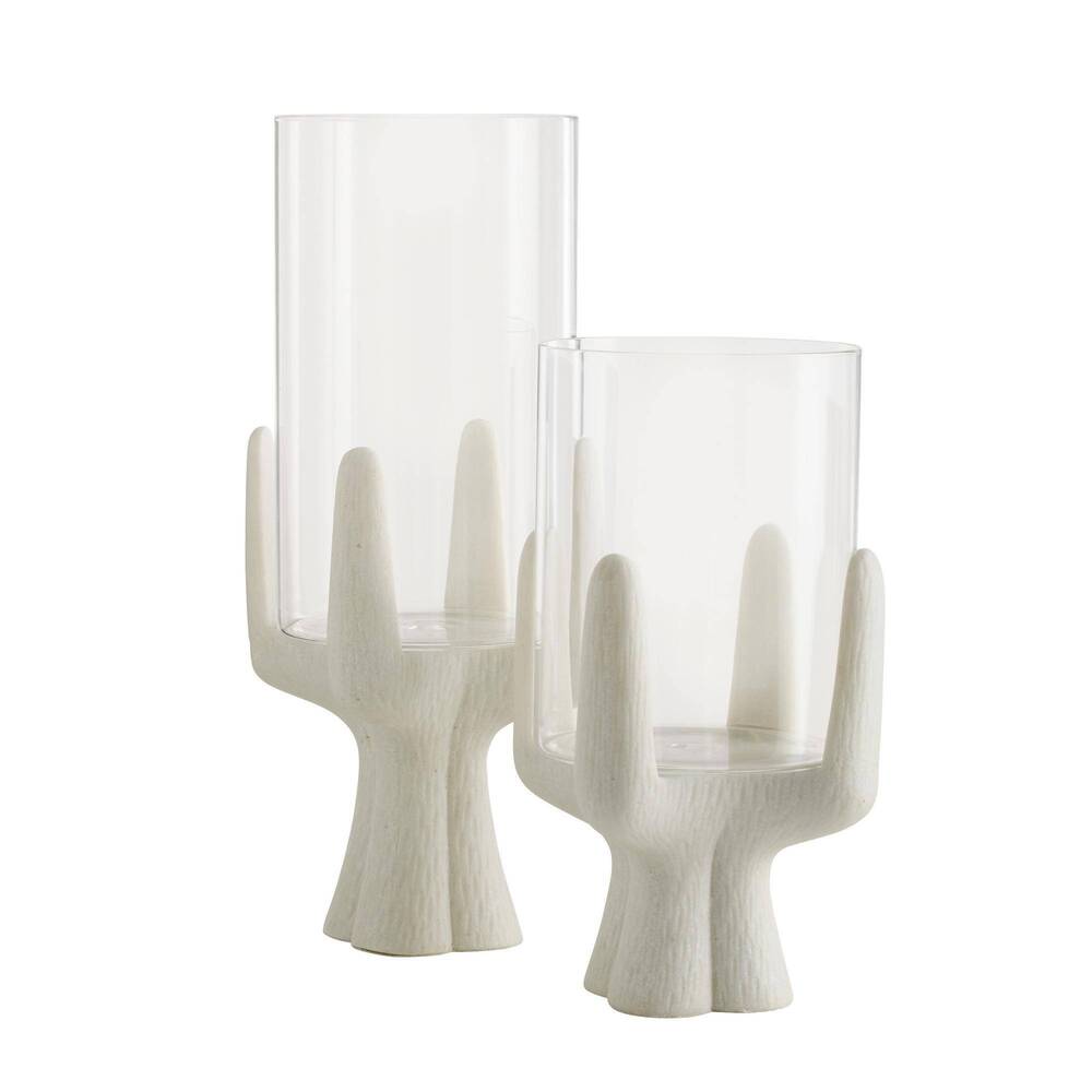 Two glass candle holders with white wooden bases on a white background