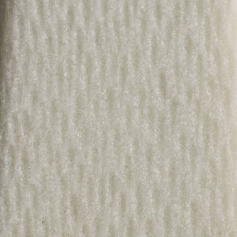 Close-up of a textured white sculpture's surface