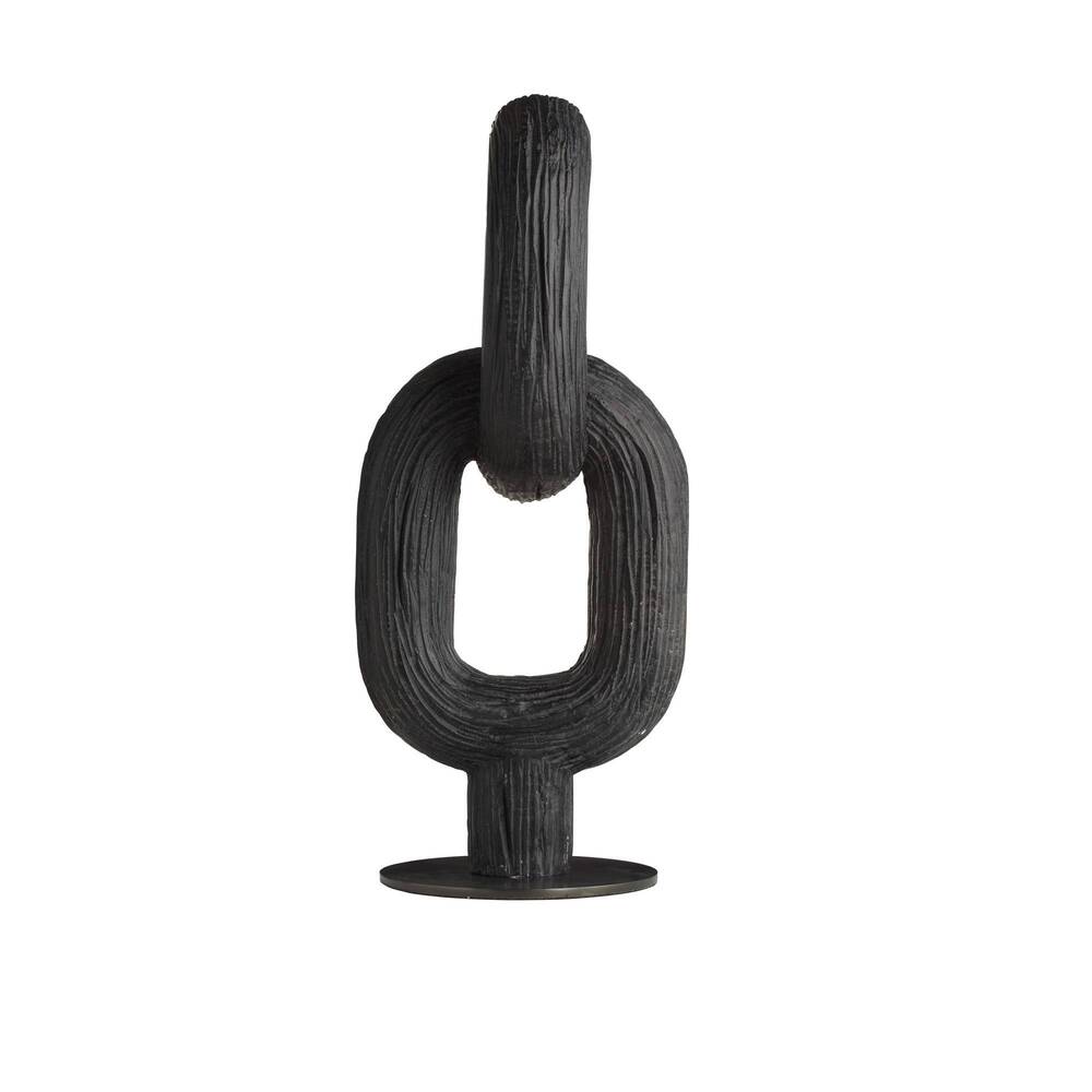 Black abstract sculpture on a white background