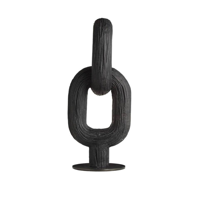 Black abstract sculpture on a white background