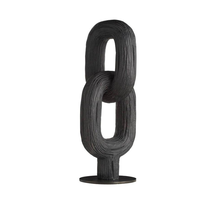Black sculpture on a white background