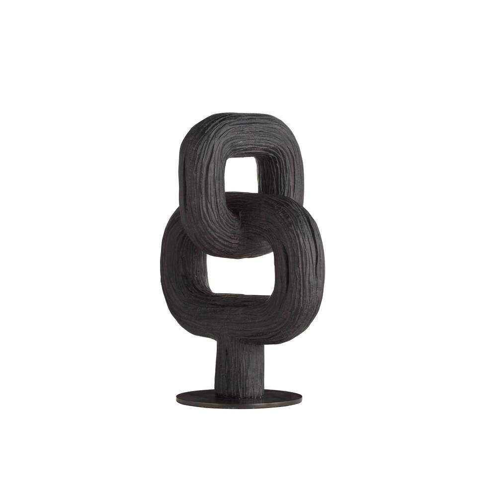 Black abstract sculpture on a white background