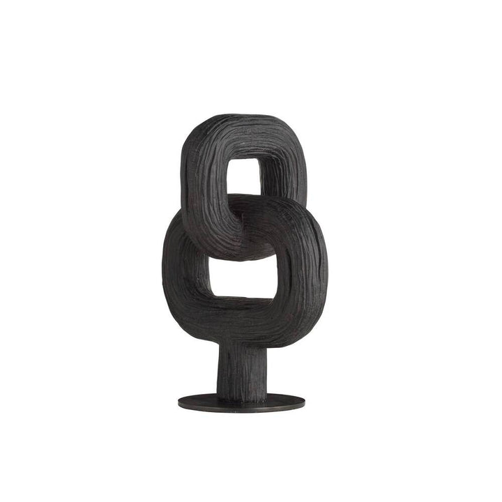 Black abstract sculpture on a white background