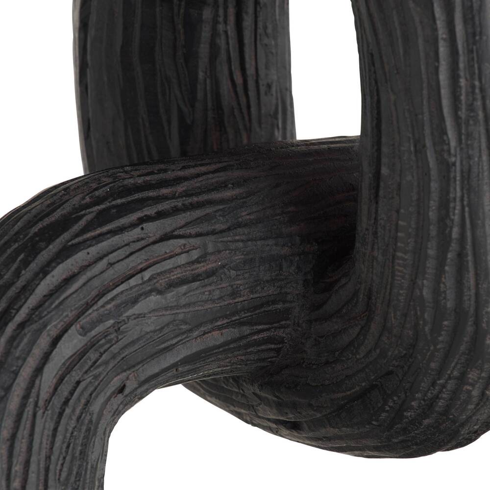 Close-up of black sculpture on a white background