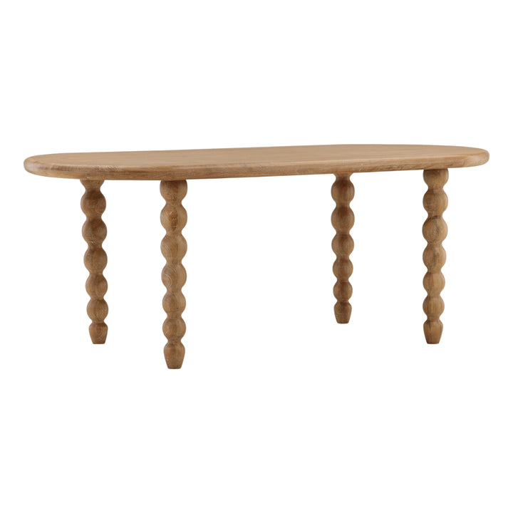 Bexwell Dining Table in light natural mango wood, three-quarter view