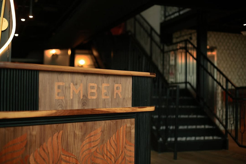 Ember tables in dark theme of restaurant