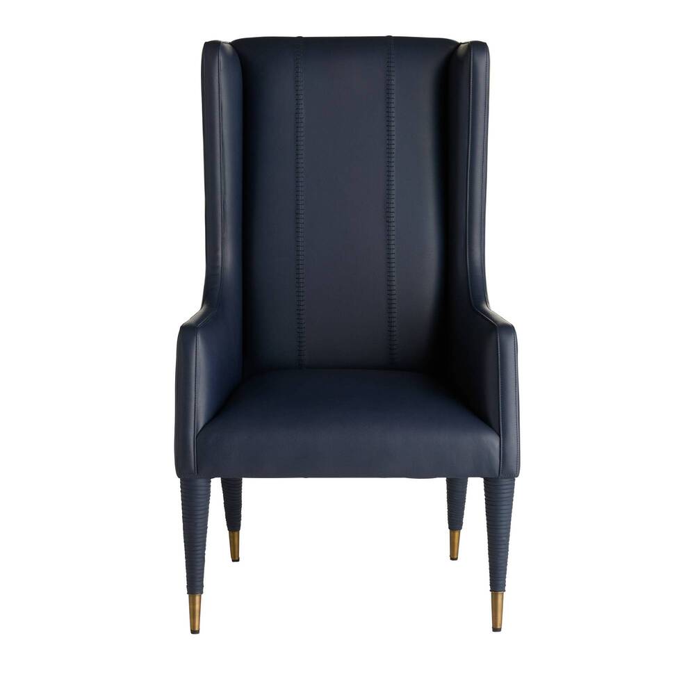 Navy wingback chair with gold legs on a white background