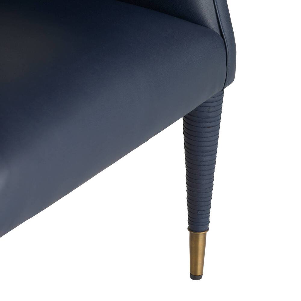 Navy blue chair with a ribbed, gold-finished leg on a white background