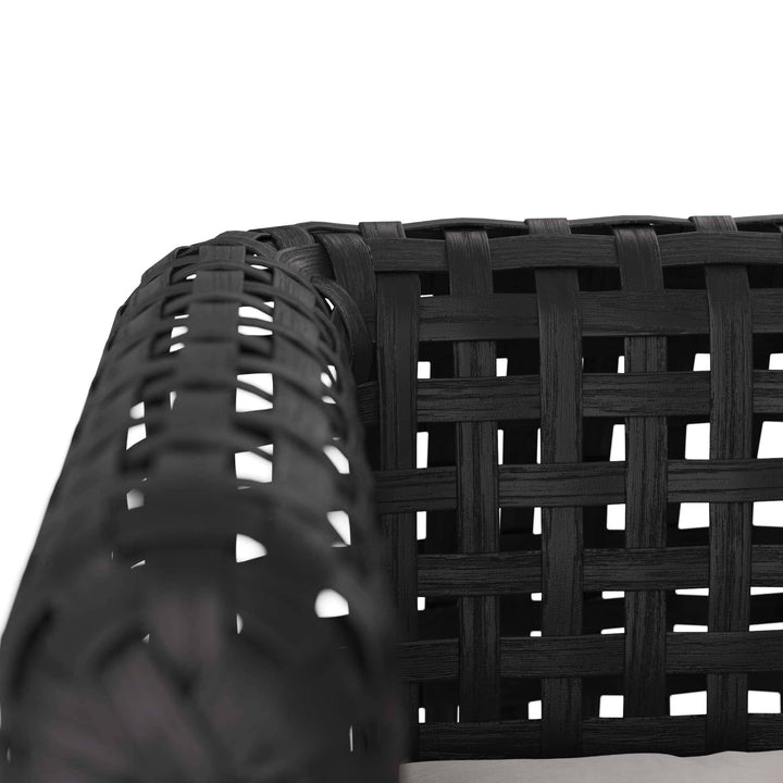 Close-up of a black woven chair  on a white background