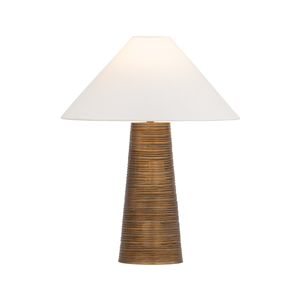 Agoura patina brass table lamp with raked cast metal base and off-white linen shade