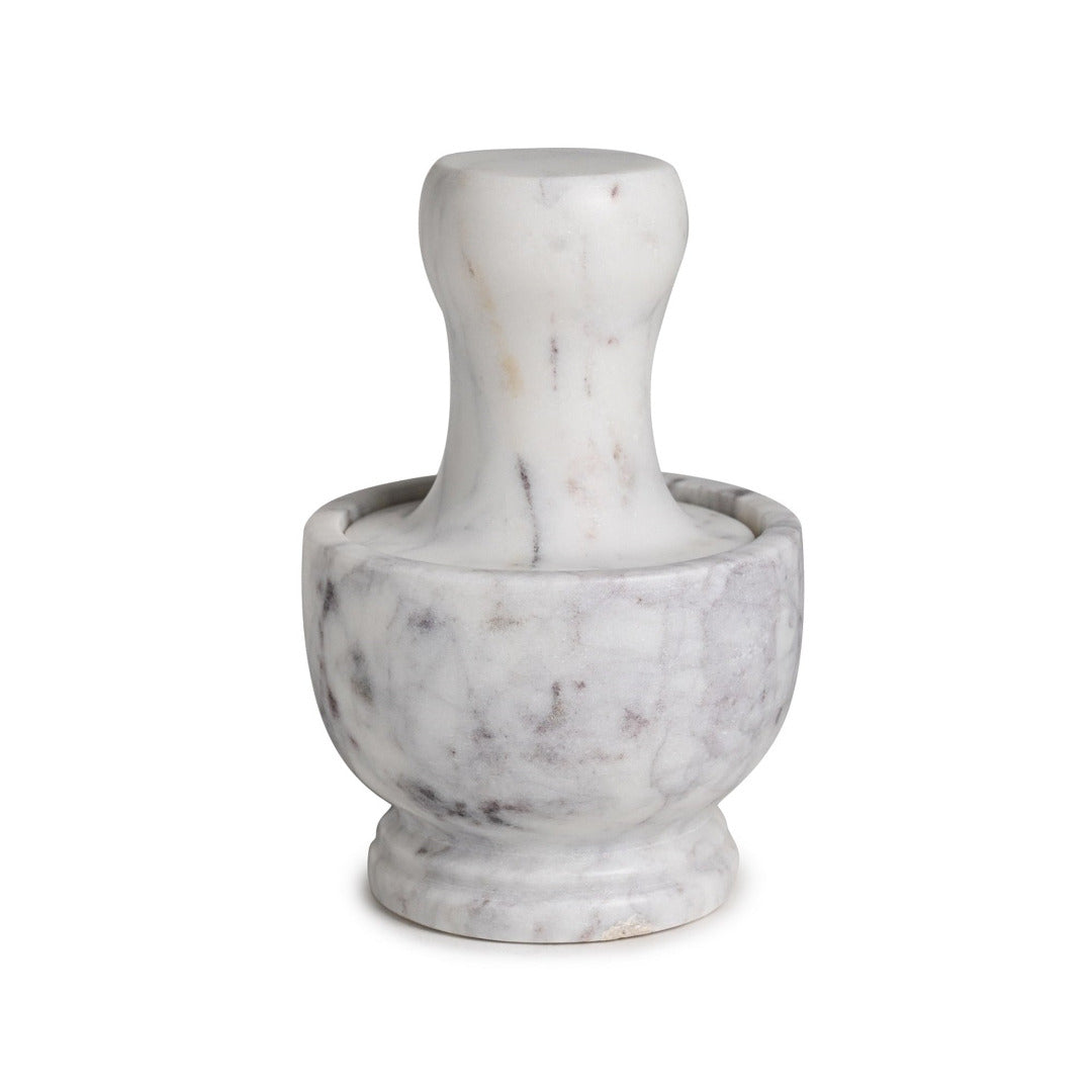 Marble mortar and pestle on a white background