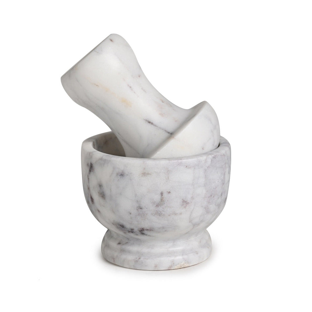 Marble mortar and pestle on a white background