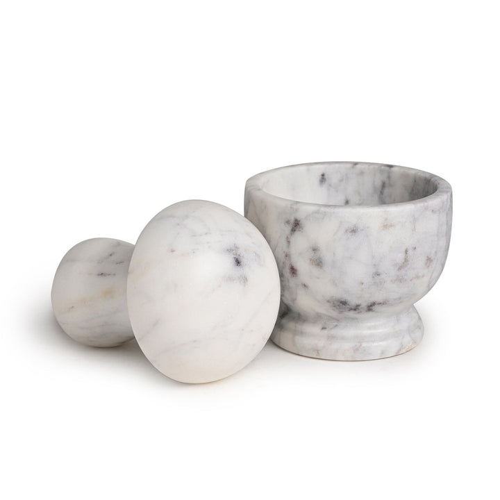 Marble mortar and pestle on a white background