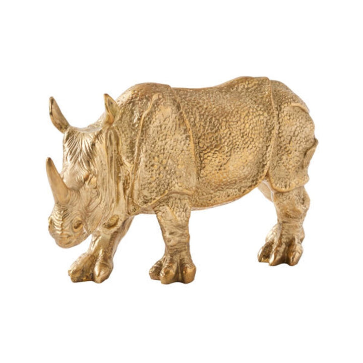 Solid brass rhino sculpture with textured hide on white background
