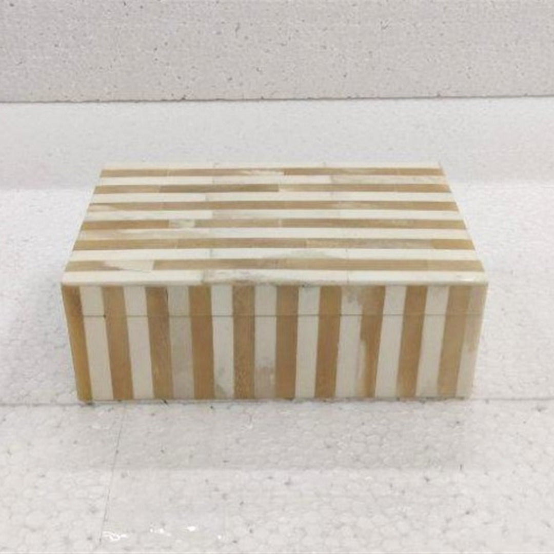 Rectangular box with striped pattern on a light gray background