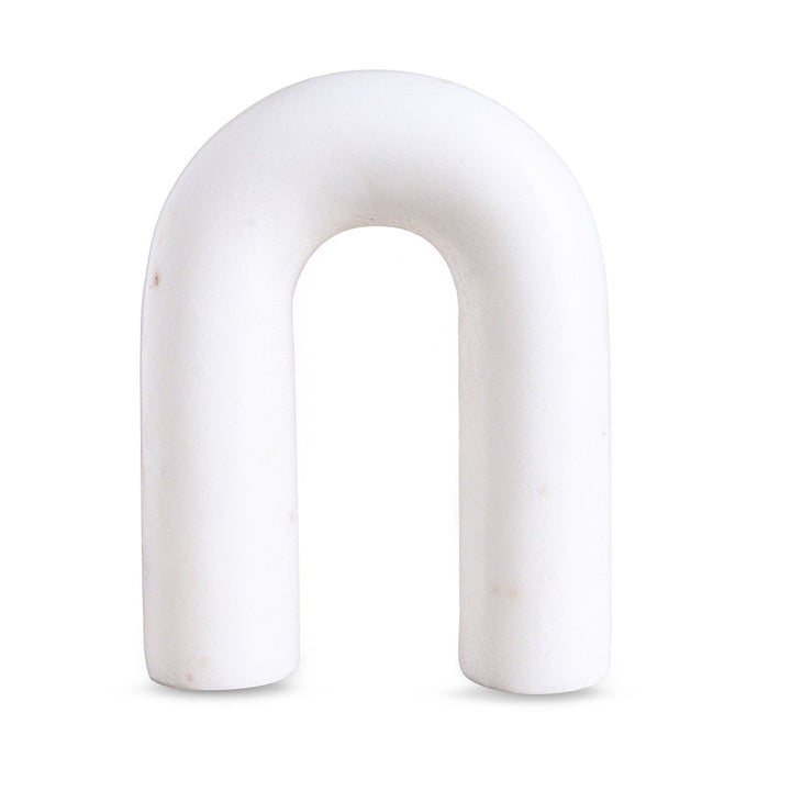 White arch-shaped marble figurine on a white background