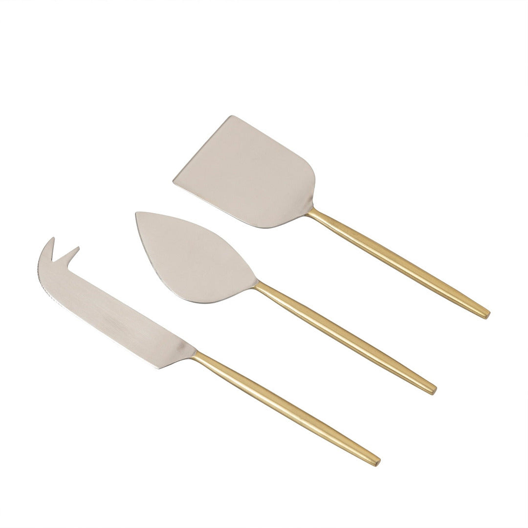 Set of three cheese tools with gold handles on a white background