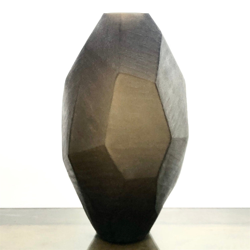 Geometrically shaped vase with smoke brown gradient on a white background
