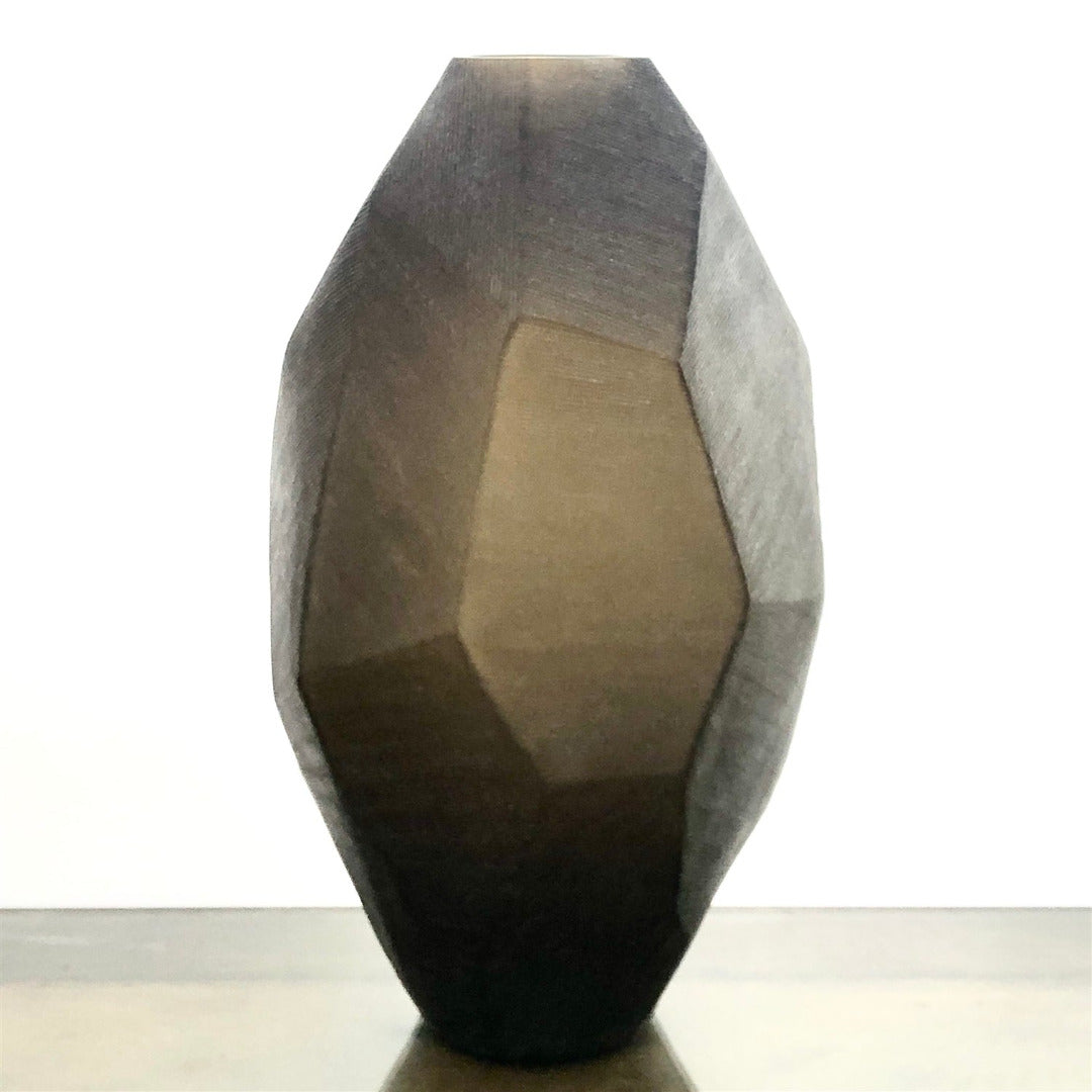 Geometrically shaped vase with smoke brown gradient on a white background